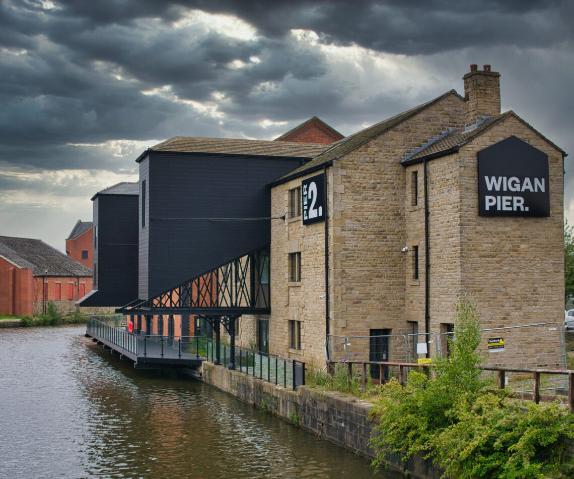 Warehouse buildings at Wigan Pier on the Leeds – Liverpool Canal. Now under redevelopment for housing and public access areas including a food hall and event centre.